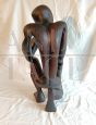 African ethnic sculpture with figure in black stained teak wood