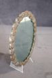 Small antique hand mirror in silver metal