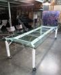 Large iron meeting or dining table with glass top
