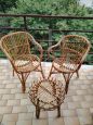 Set of two vintage wicker armchairs and coffee table