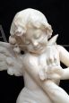 Antique Napoleon III alabaster sculpture depicting a winged cherub