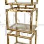 Design bookcase with cubes in brass and glass