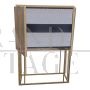 Design bar cabinet covered in colored mirrors with internal drawer