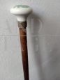 Walking stick with painted ceramic knob