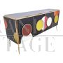Backlit sideboard in black glass with colored circles
