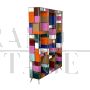 Open bookcase in wood covered in colored glass