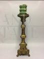 Antique church candlestick in gilded bronze
