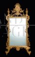 Antique Louis XV style mirror in gilded and carved wood, Tuscany early 1900s