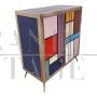 Two-door sideboard covered in colored glass squares