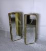 Pair of golden bathroom wall cabinets with mirror surface