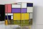 Vintage 1970s dresser covered in colored glass