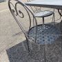 Garden set with 6 chairs and a large wrought iron table