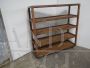 Industrial wooden shelving unit with wheels, 1920s