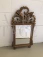 Antique gilded Empire period carved mirror with quiver and torch