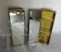 Pair of golden bathroom wall cabinets with mirror surface