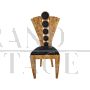 Design chair in briarwood and black leather with fan-shaped backrest                            