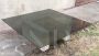Large vintage coffee table, granite base, smoked glass top. 60's.