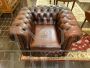 Large vintage Chesterfield armchair in burgundy leather