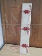 White vintage wall coat rack with 3 red decorated hooks