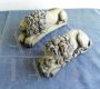 Pair of small sculptures of sleeping lions, inspired by Antonio Canova