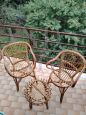 Set of two vintage wicker armchairs and coffee table