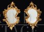 Pair of antique Louis Philippe mirrors in carved and gilded wood