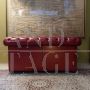 English red Chesterfield sofa