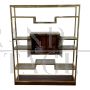 Design bookcase in brass and makassar with central display case