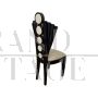 Design black chair in white leather with fan-shaped backrest