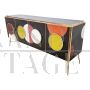 Backlit sideboard in black glass with colored circles