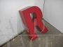 Vintage red plastic letter R from a 1970s sign