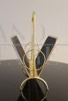 Magazine rack in brass and black lacquered metal, Italy 1970s