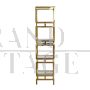 Design bookcase with cubes in brass and glass