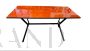 1960s iron table with orange glass top