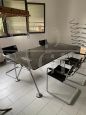 Nomos table and shelves by Tecno