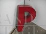 Vintage red plastic letter P from a 1970s sign