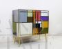 Vintage 1970s dresser covered in colored glass