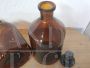 Pair of vintage glass apothecary bottles with stopper