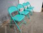 Set of 4 folding chairs in light blue metal