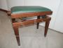 Adjustable vintage piano stool in wood and green skai