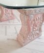 Vintage low coffee table with sculpted pink granite legs and glass top