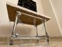 Coffee table in chromed rod with top in travertine marble