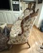 Antique carved sofa in floral fabric