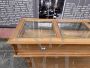 Vintage wooden shop counter with glass top