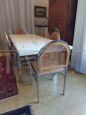 Design dining set with table and 6 chairs in steel and Vienna straw