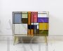Vintage 1970s dresser covered in colored glass