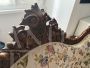 Antique carved sofa in floral fabric