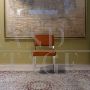 Vintage chair in metal and orange fabric
