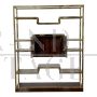 Design bookcase in brass and makassar with central display case