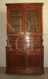 Two-body antique cupboard with glass doors from the early 1900s